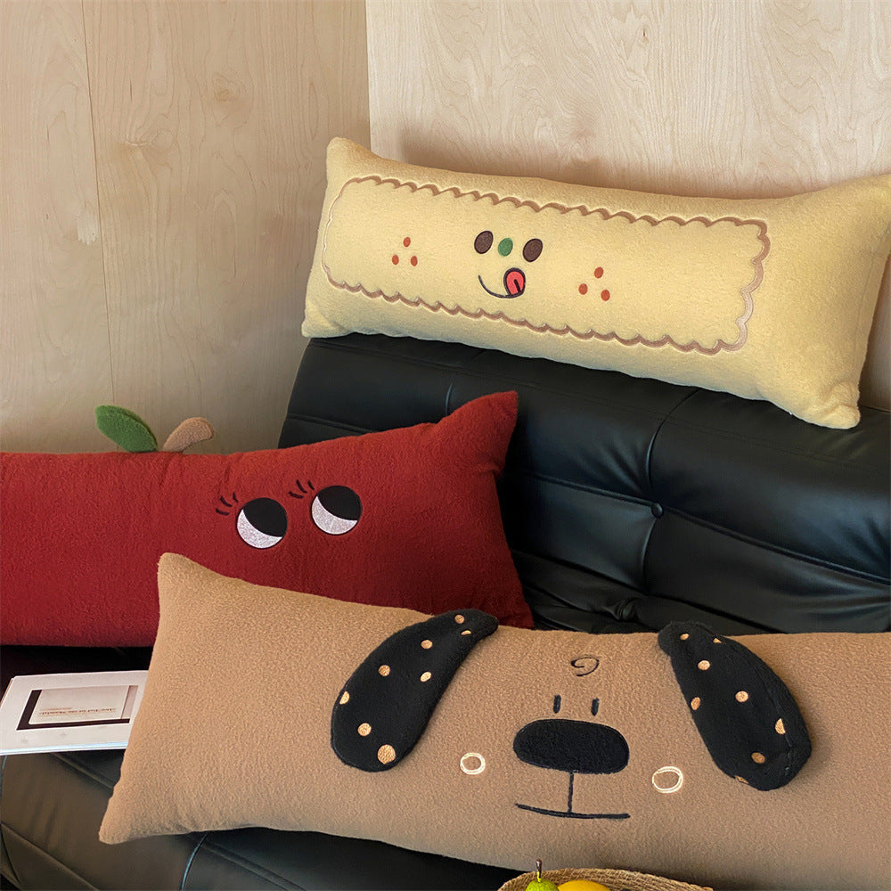 Extra-long plush sofa cushion with appliqués and plush feet