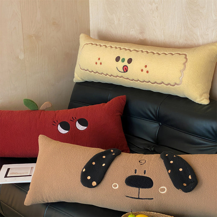 Extra-long plush sofa cushion with appliqués and plush feet
