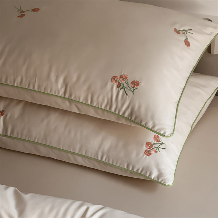 Luxurious cotton satin bedding set with delicate floral embroidery and a silky-matte surface