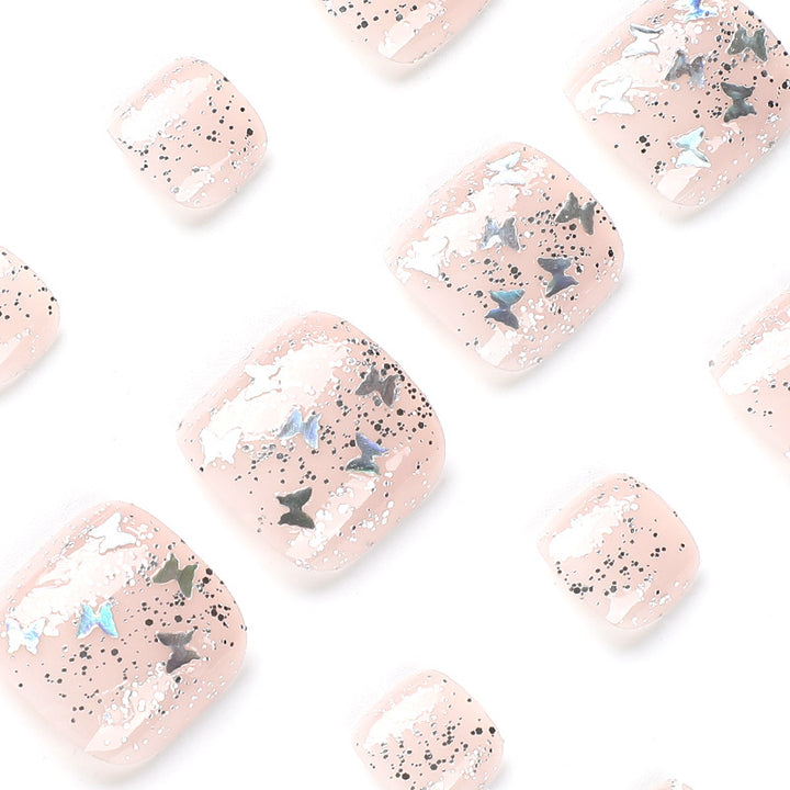 Artful toenail art with glitter and butterfly designs Kalsten