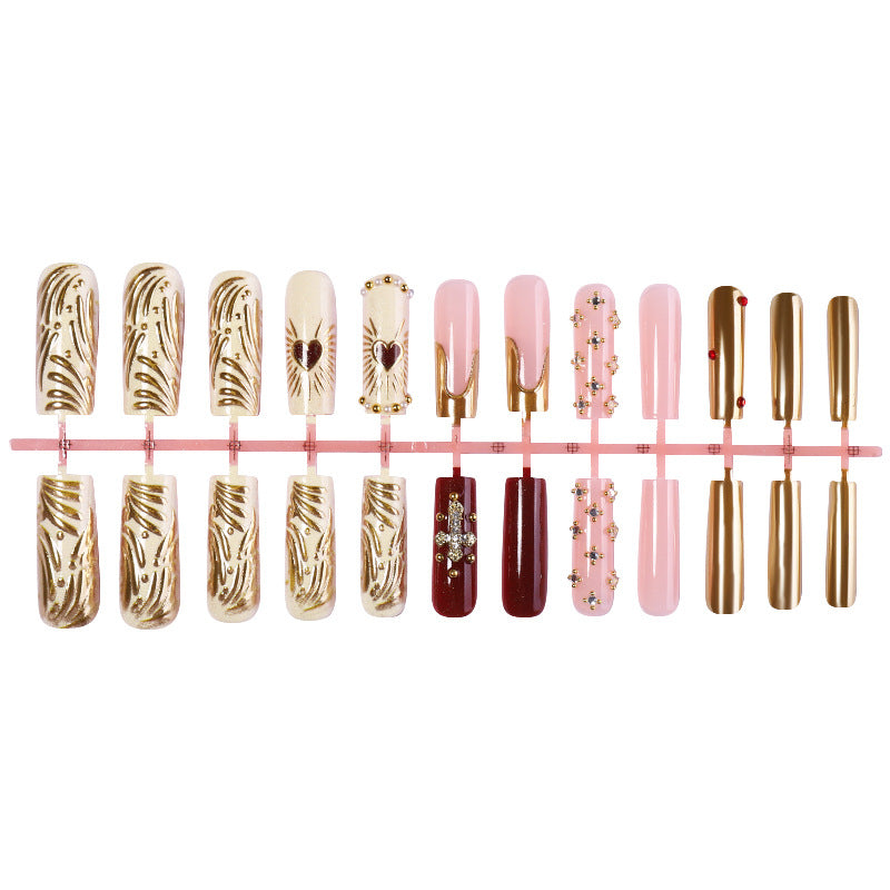 Acrylic nail set with luxurious golden accents and sparkling embellishments Kalsten