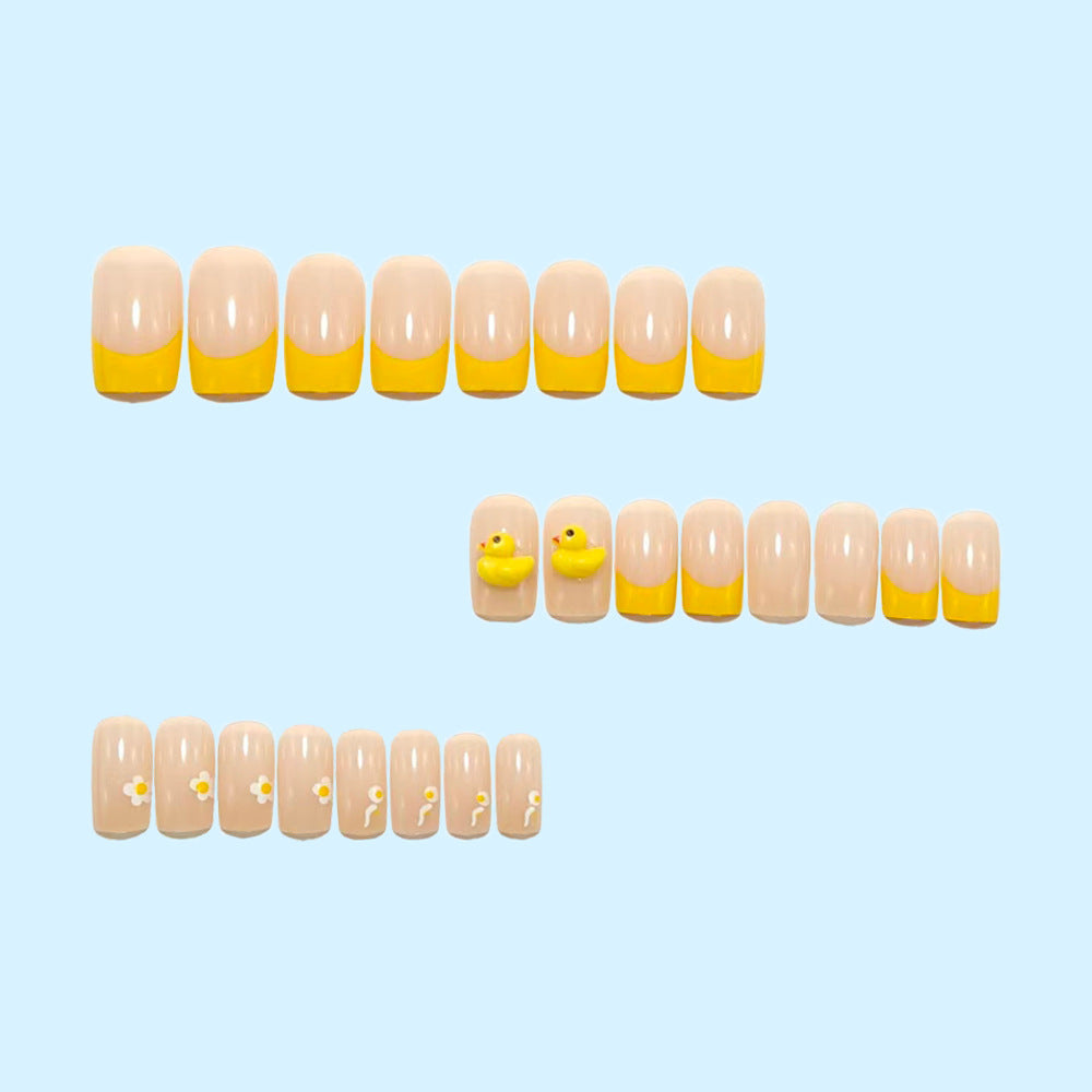 Artificial nails with playful duck motif and spring accents Kalsten