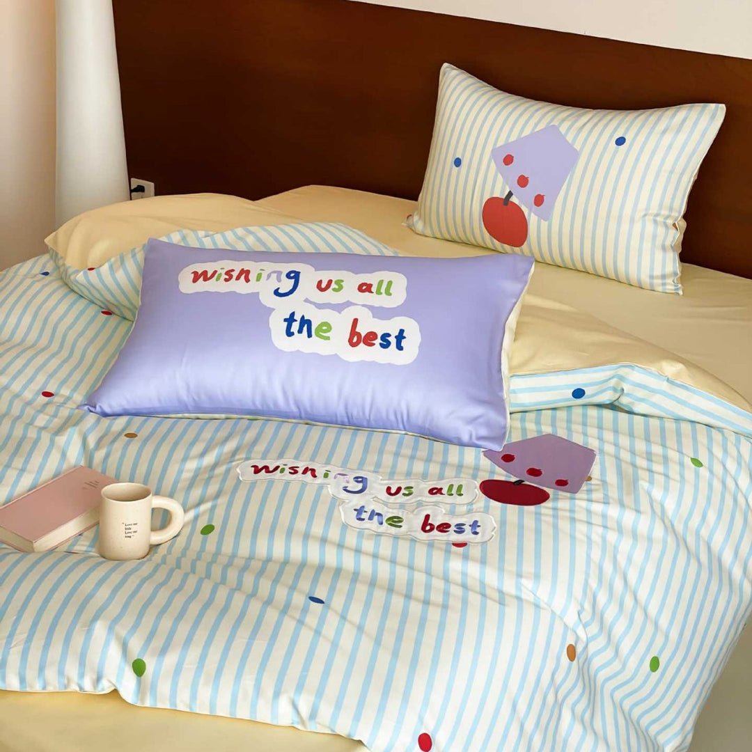 Children's bedding set made of cotton percale with striped design, appliquéd lettering, and playful dot appliqués