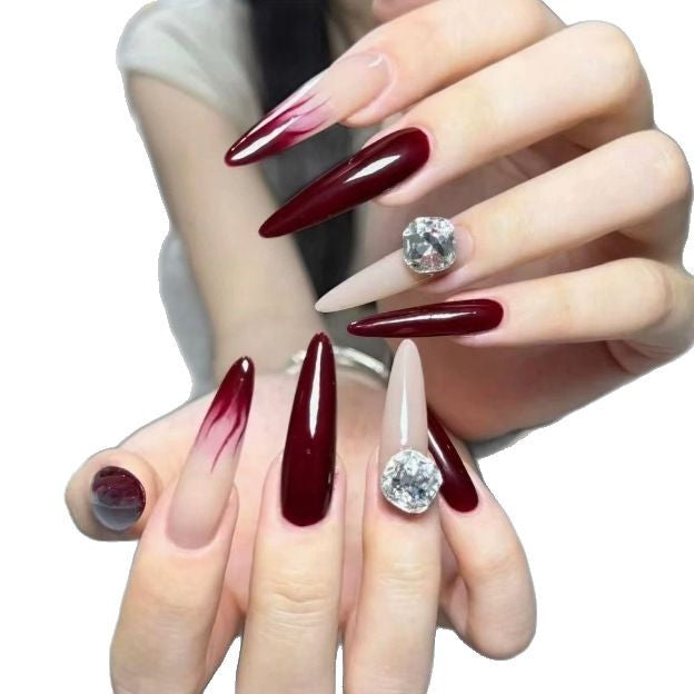 Elegant Stiletto Nail Enhancements with Gem Accents Kalsten