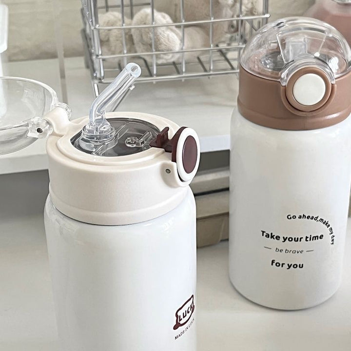 Women's insulated drinking bottle with innovative flip lid and practical handle Kalsten