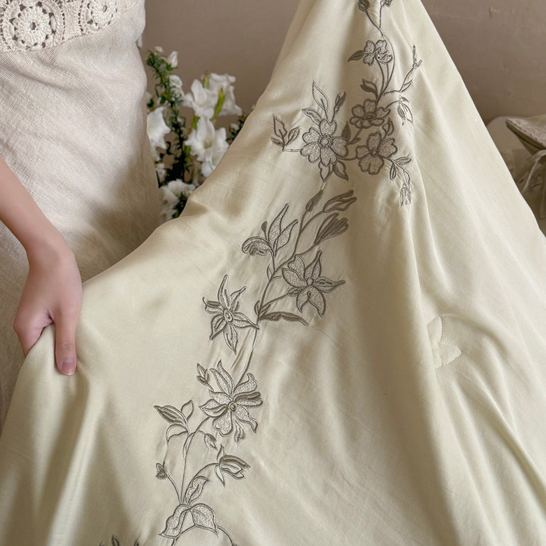 Elegant bedding set made of cotton satin with floral embroidered border and decorative roll cushion Kalsten