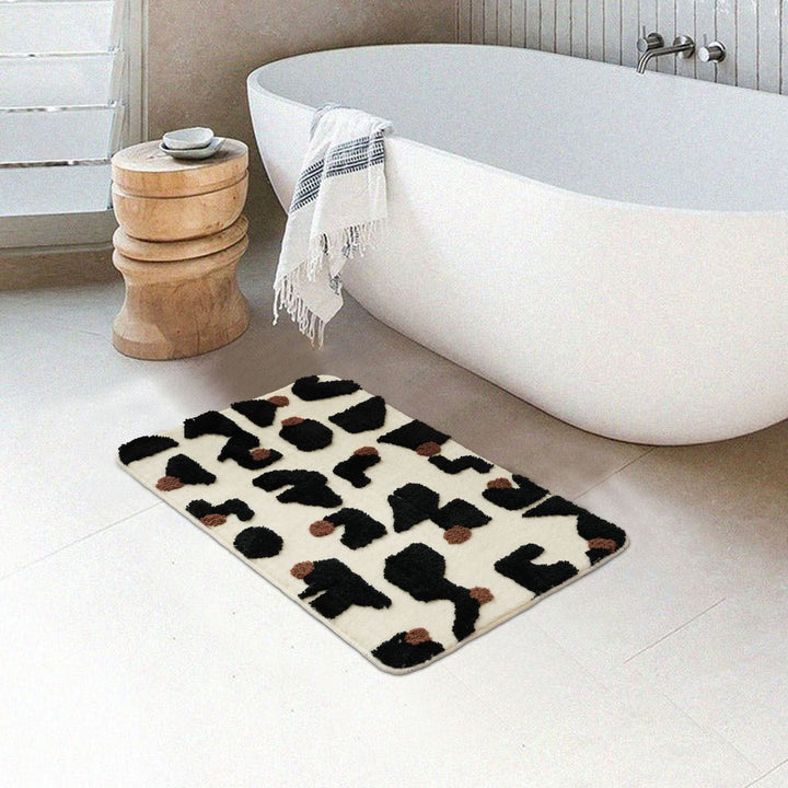 Tufted bathroom mat in abstract leopard pattern with soft high pile Kalsten
