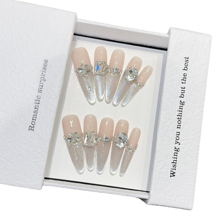 Glamorous artificial nails with sparkling rhinestone embellishments Kalsten