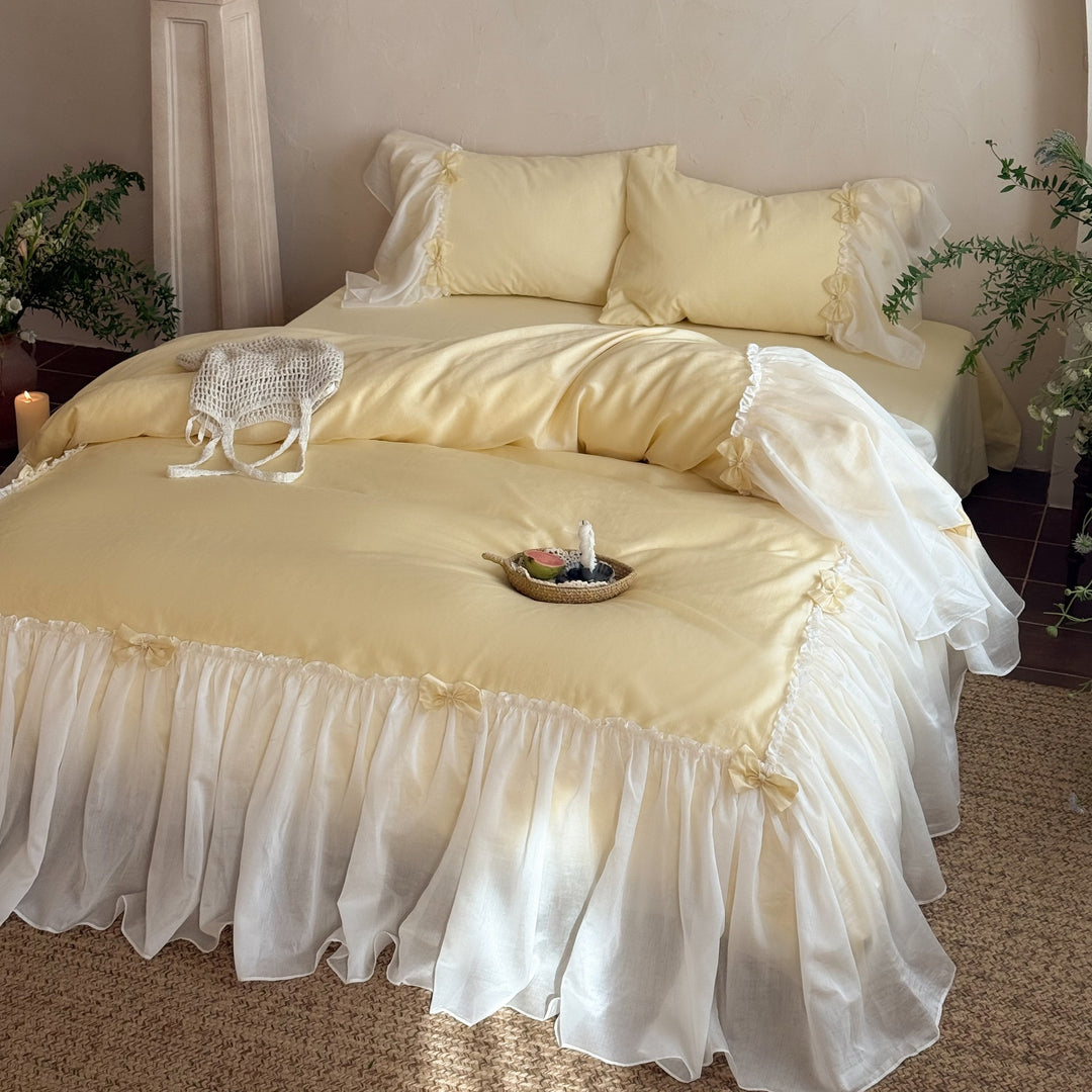 Bedding set with ruffled bed skirt, ruffle cushion and bow application