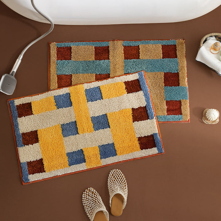 Rectangular tufted door mat with geometric block pattern and non-slip backing Kalsten