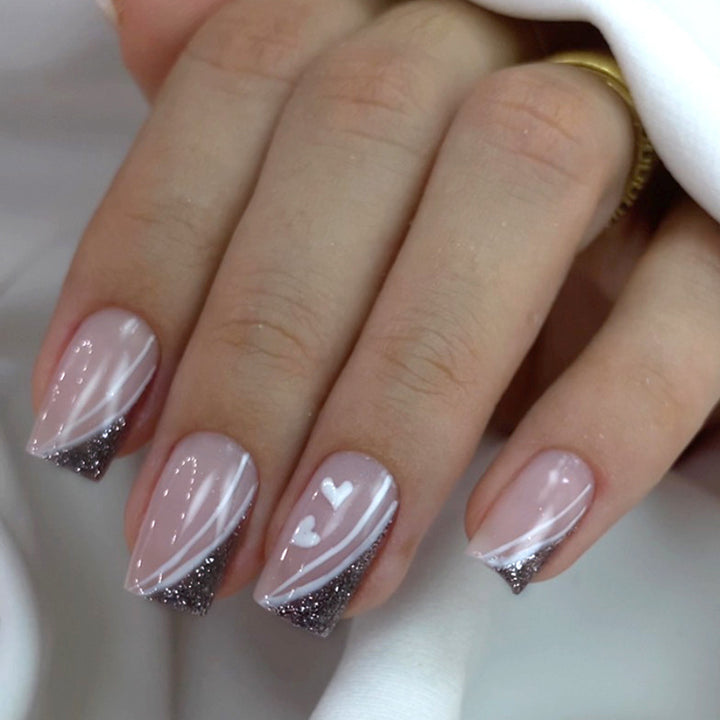 Artistic Nail Art with Elegant Glitter and Heart Design Kalsten
