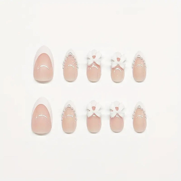 Artistic Press-On Nail Design with Bow Accents Kalsten