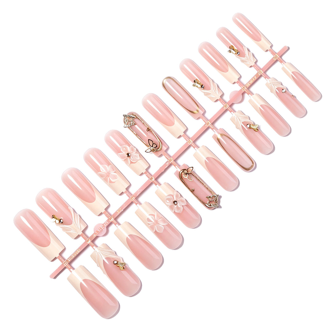 Nail art set with elegant 3D floral designs and glitter accents Kalsten