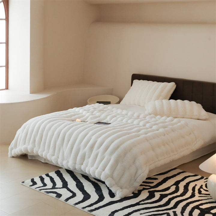 Faux fur blanket with ribbed structure design and velvety soft pile