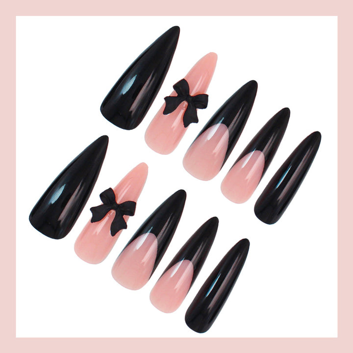 Acrylic nail set with elegant black-and-white design and playful accents Kalsten