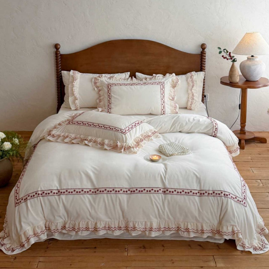 Romantic bedding set with ruffles and embroidered border
