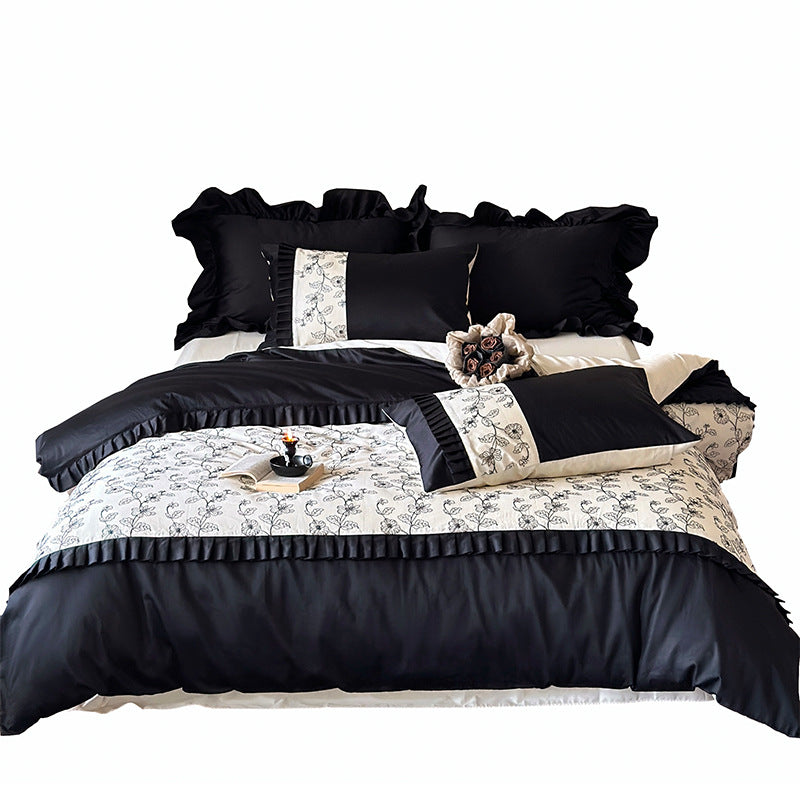 Luxurious cotton satin bedding set with ruffles and delicate floral embroidery