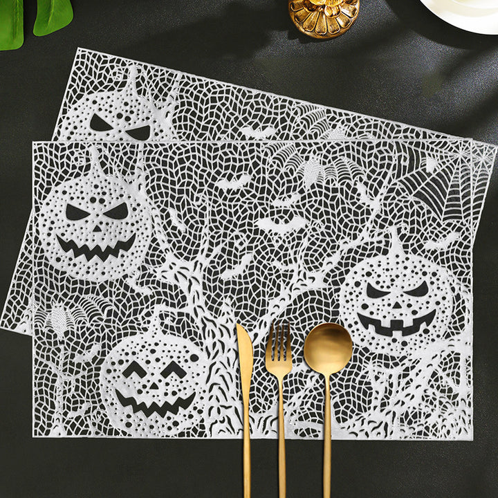 Halloween plastic table mats with intricate pumpkin and spider web design