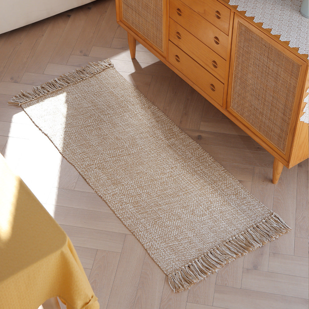 Woven table runner made of cotton blend with fine structure and herringbone look as well as decorative fringes Kalsten