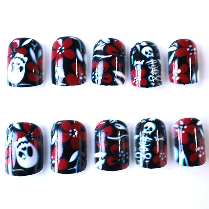 Artificial nail set with creepy skull design and floral accents Kalsten