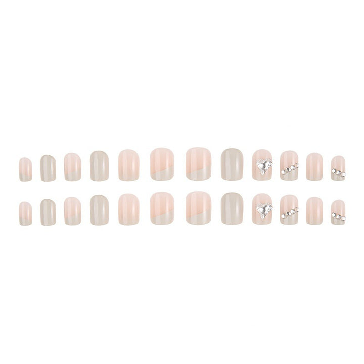 Glamorous artificial nails with heart and rhinestone decorations Kalsten