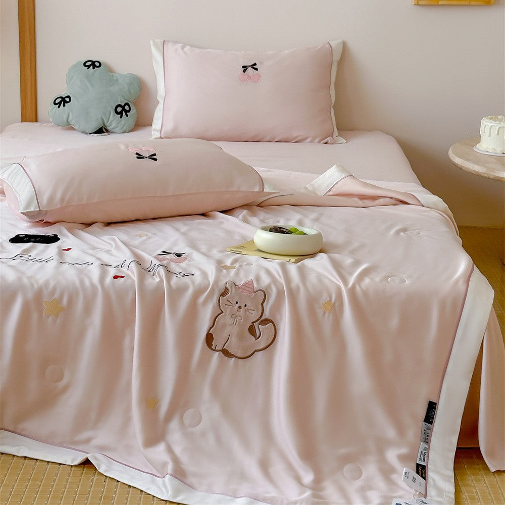 Satin bedding set with embroidered cat appliqués and silky soft finish