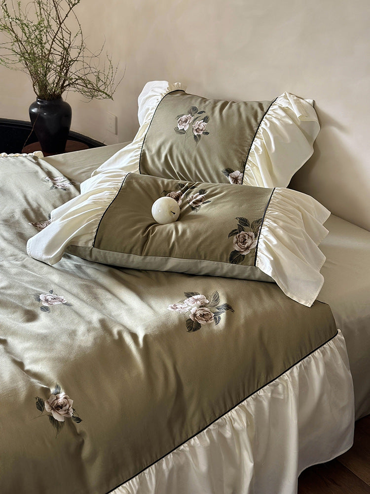 Luxurious satin bedding set with floral embroidery and frills
