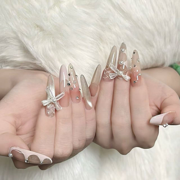 Elegant Stiletto Nail Art Extensions with Decorative Accents