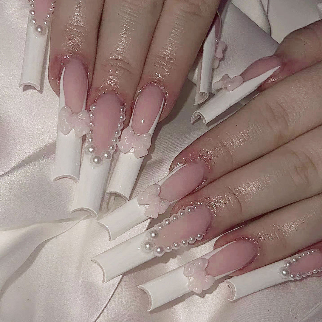 Artistic and elegant acrylic nails with pearl and flower decor Kalsten