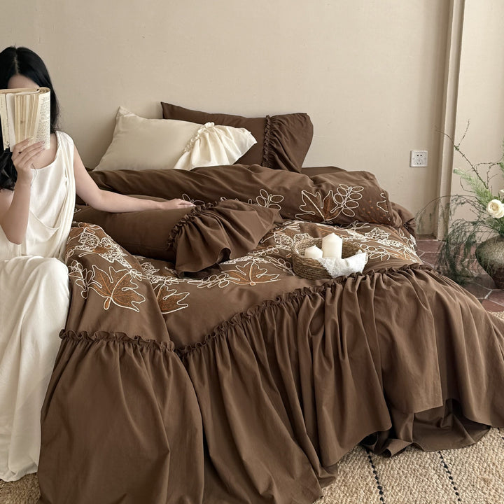 Bedding set with embroidered leaf pattern, ruffled bed skirt and ruffled pillow