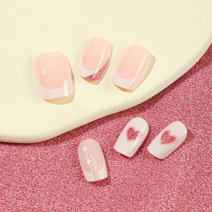 Artful nail designs with heart and glitter accents Kalsten
