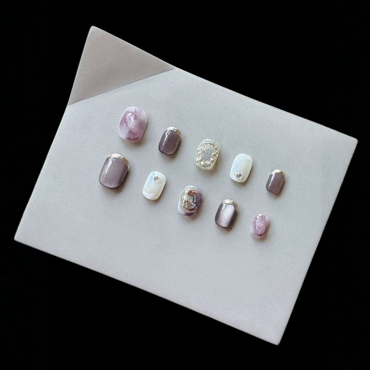 Artistic Press-On Nail Art Set with Unique Ombre and Metallic Accents