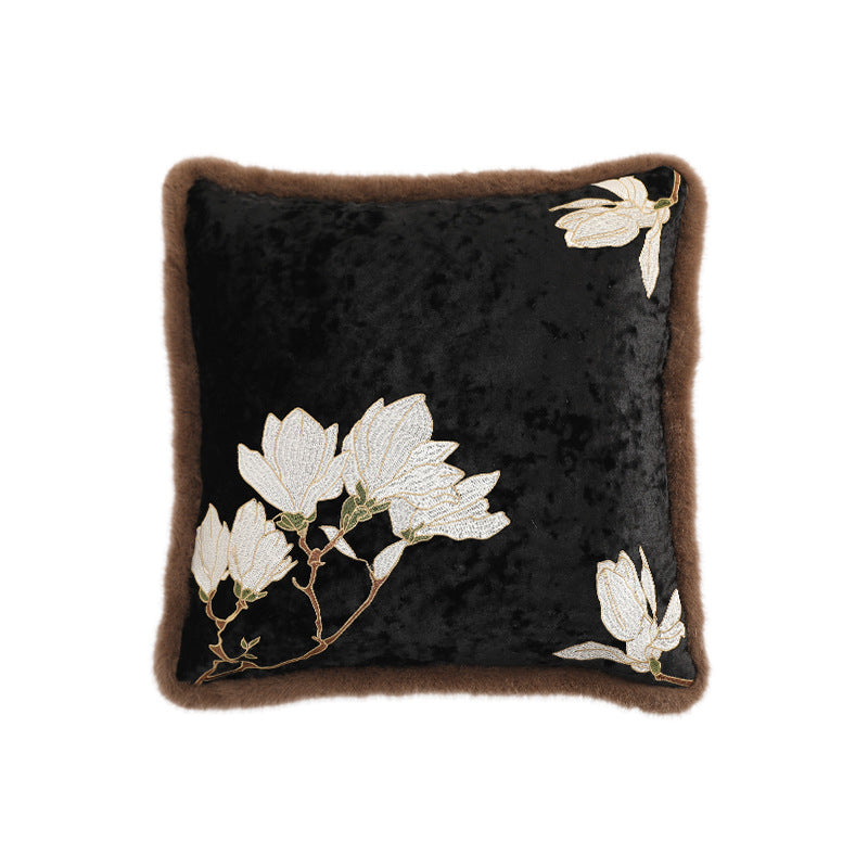 Square velvet decorative cushion with embroidered magnolia motif and faux fur border