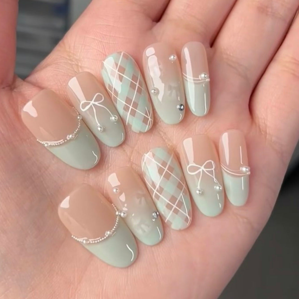 Decorative Press-On Nail Extensions with Bow and Rhinestone Accents Kalsten