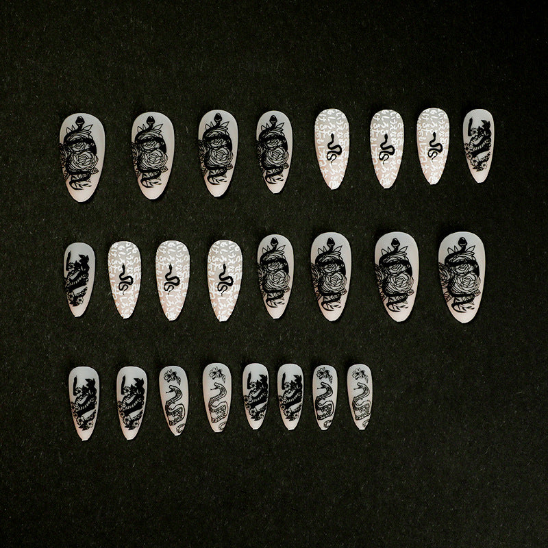 Artful nail extensions in elegant stiletto style with artistic floral and graphic designs Kalsten