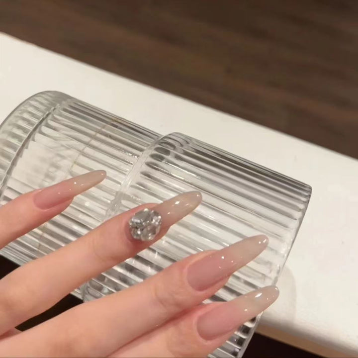 Stiletto Acrylic Nail Enhancements with Rhinestone Accents