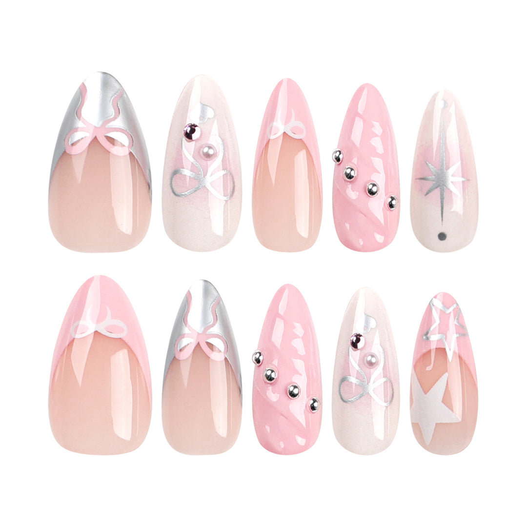 Artistic Nail Art with decorative bows and glitter accents Kalsten