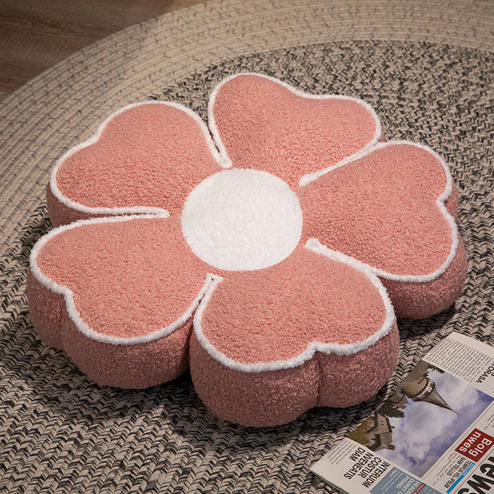 Padded seat cushion in flower shape with faux leather center piece and fluffy edge padding