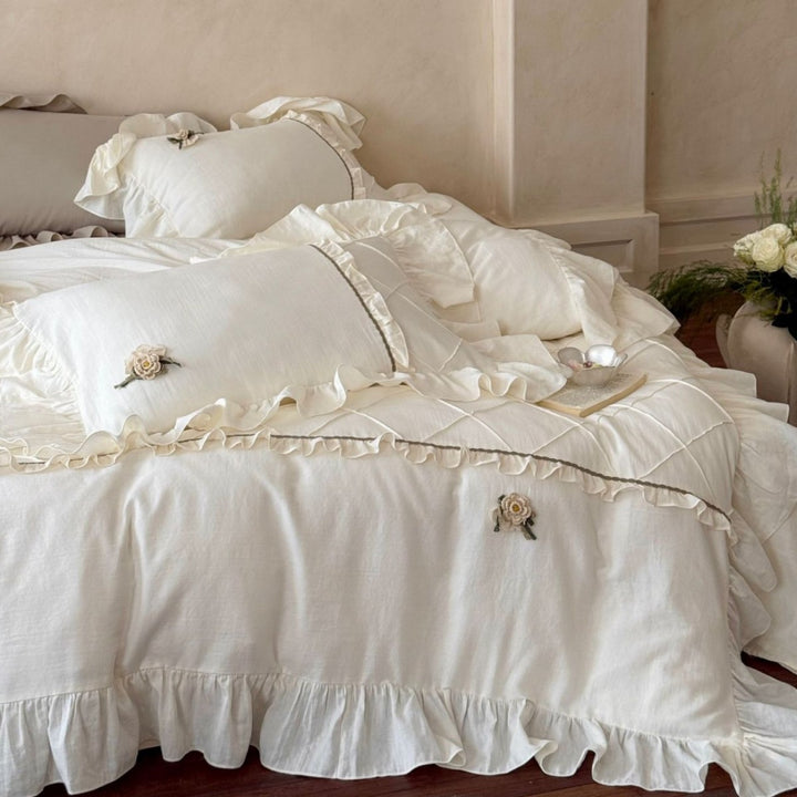 Country house style bedding set with quilted center piece, ruffle and rose appliqué