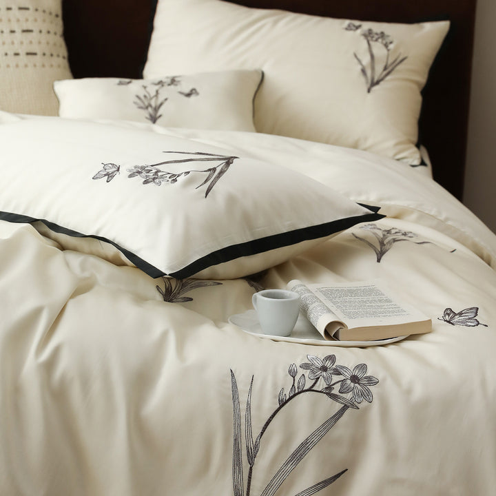 High-quality bedding set made of cotton satin with fine embroidery and black piping