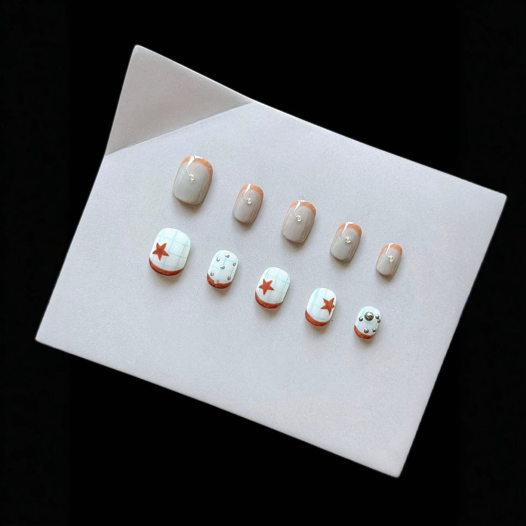 Artistic Press-On Nail Art Set with Star and Metallic Accents