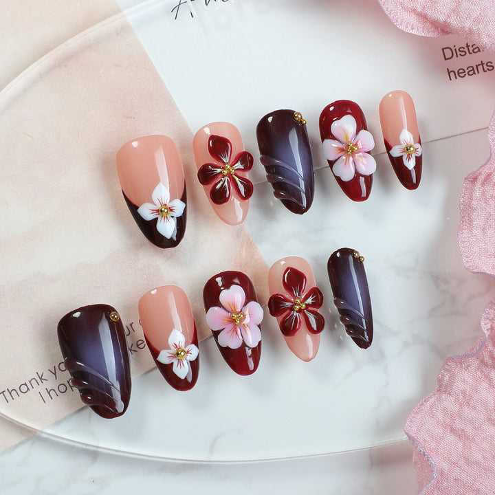 Acrylic nail set with floral accents and luxurious decorations Kalsten