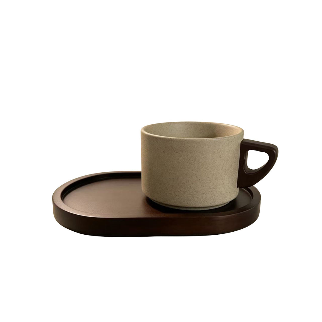 Ceramic mug with ergonomic wooden handle and matching coaster