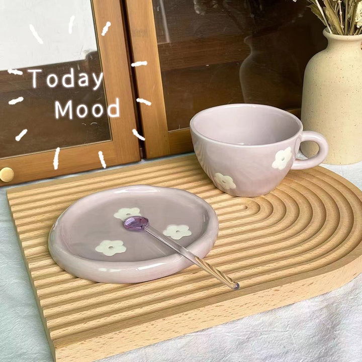 Large ceramic bowl as coffee and tea cup with matching saucer and decorative flower appliqués