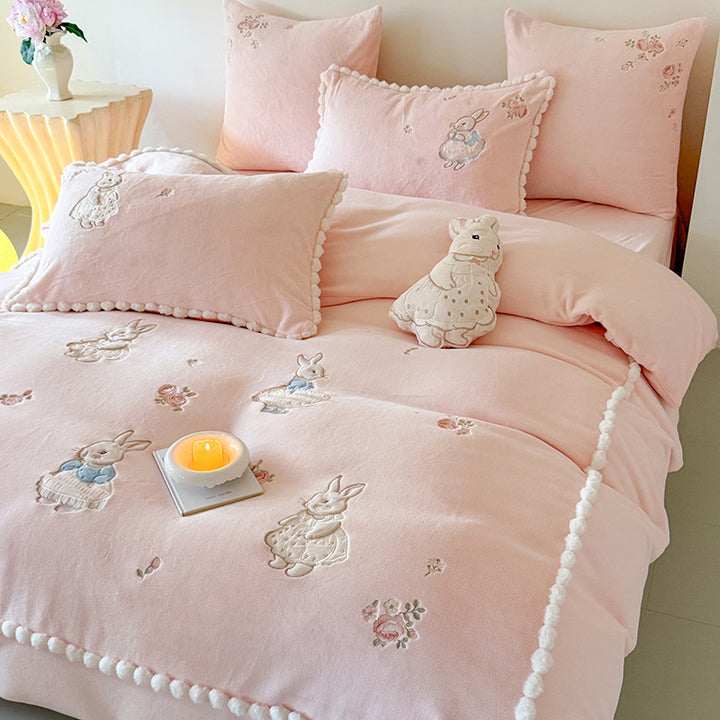 Cute cotton bedding set with embroidered bunny appliqués and pom-pom trim