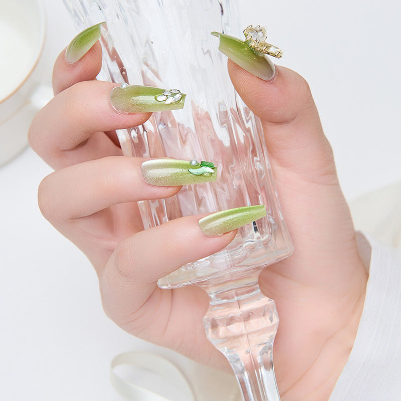 Artificial nails with butterfly accents and glitter details Kalsten