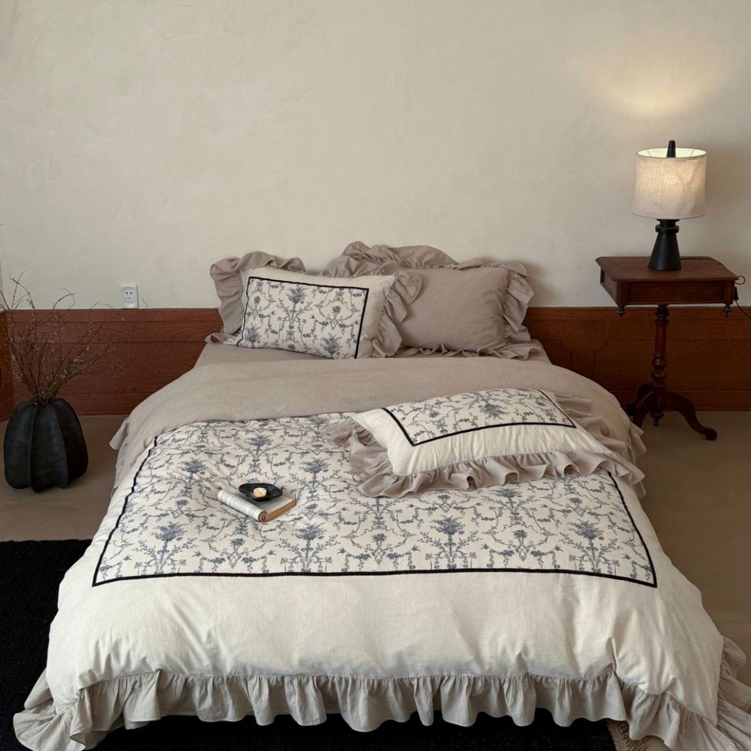 Romantic linen-look bedding set with ruffle, quilted center panel, and fine floral jacquard