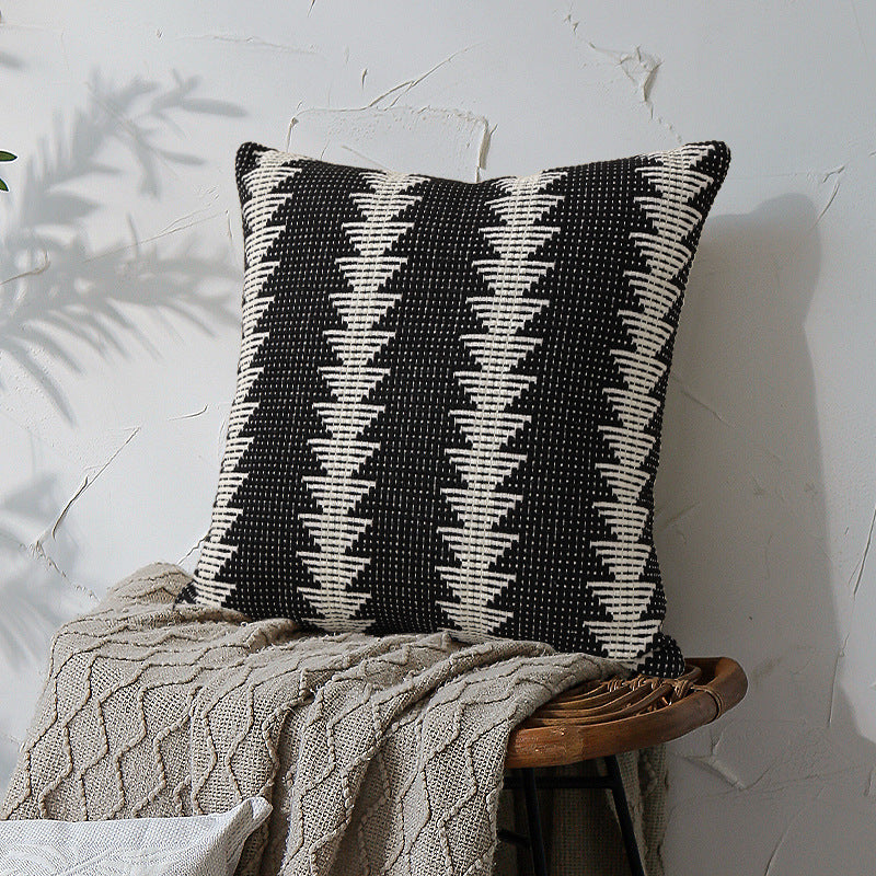 Rectangular woven decorative cushion in ethnic stripe pattern with tuft relief and detachable cover