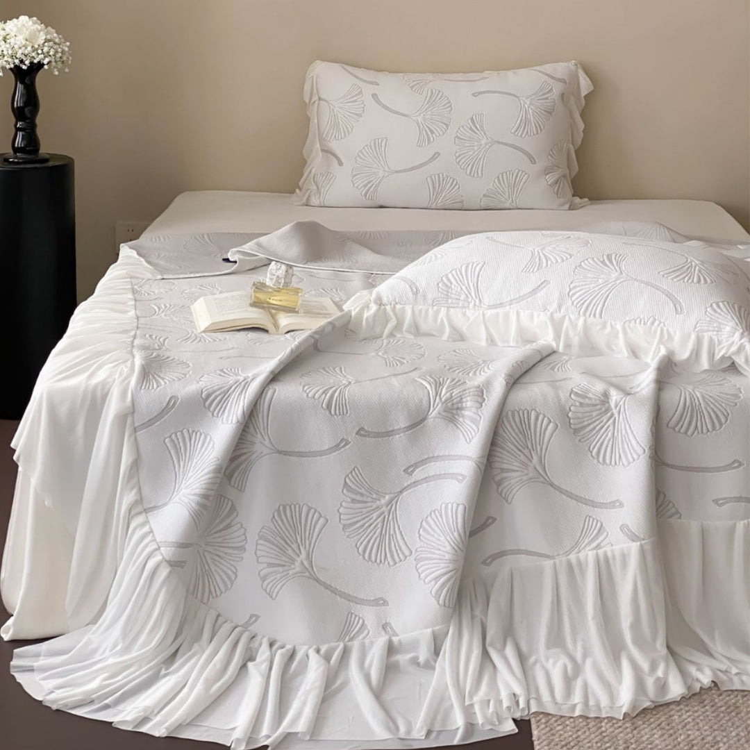 Quilted bedspread set with ginkgo leaf relief, ruffled bed skirt and pillowcases