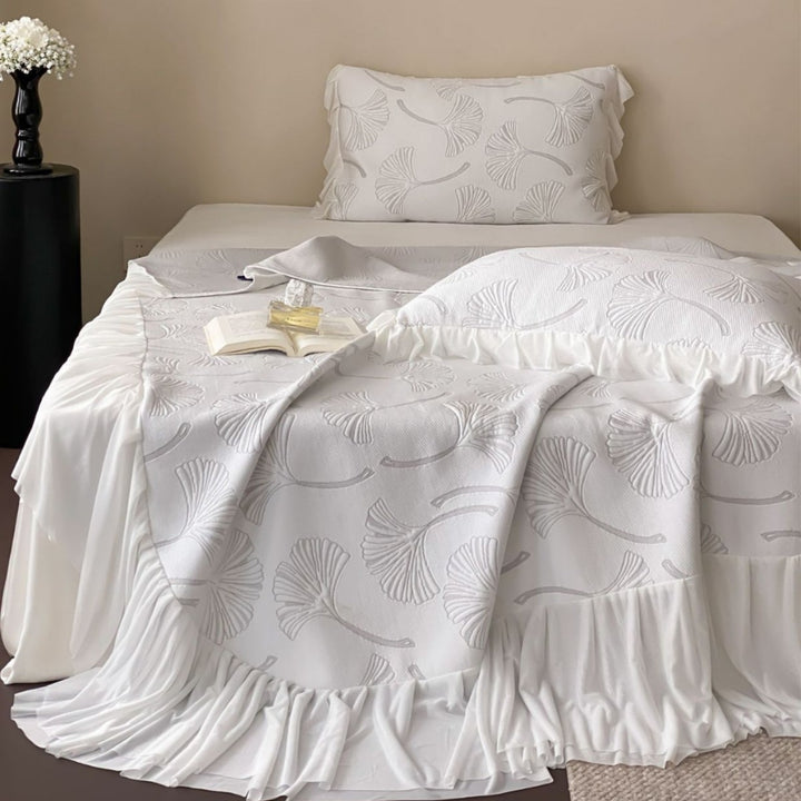 Quilted bedspread set with ginkgo leaf relief, ruffled bed skirt and pillowcases